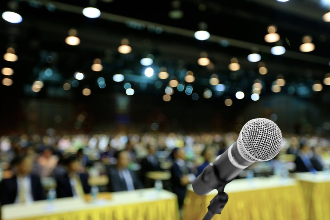 Microphone voice speaker with audiences or students in seminar classroom, lecture hall or conference meeting in educational business event for host, teacher, or coaching mentor.